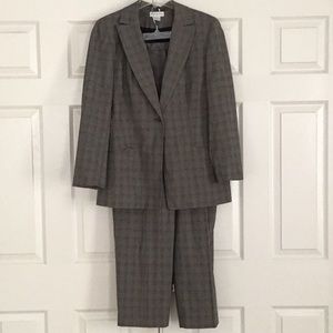 Tweed black, red and white suit. Jacket and pants are lined